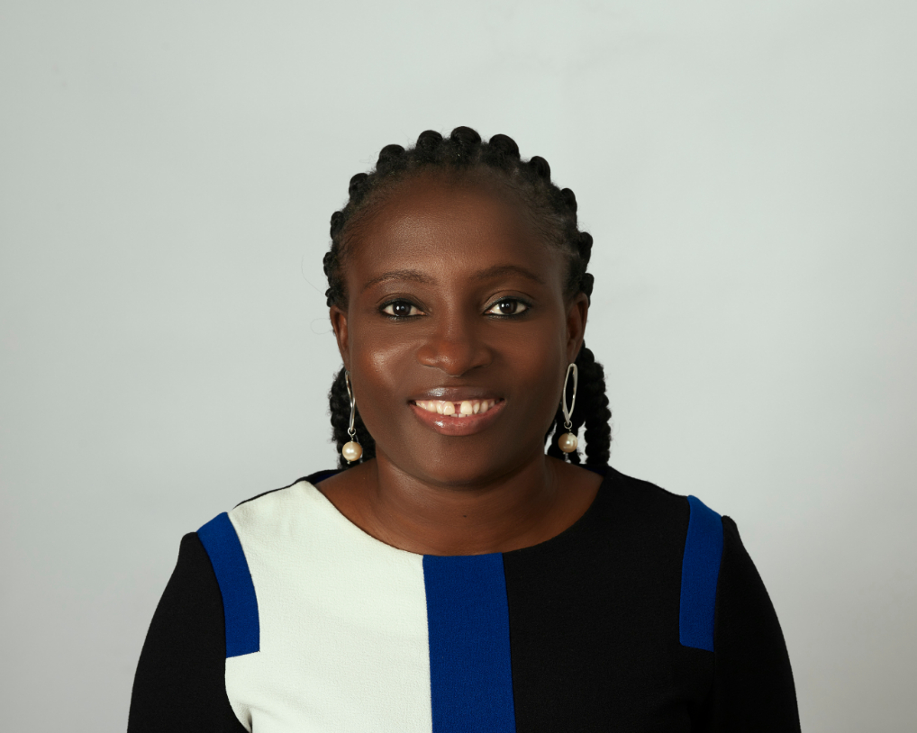 Elizabeth Akinde smiling for a work photo op